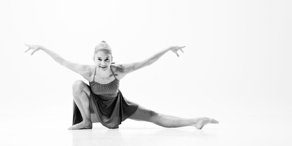 dancer posed in an extended crouch